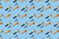 Seamless regular pattern with adjustable wrench, hammer and nut on a light blue background. Hard light. Father`s day holiday