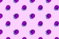 Seamless regular pattern with Christmas balls on a purple background. Hard light. The concept of New Years and Christmas