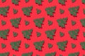 Seamless regular pattern with green Christmas trees on a red background. Hard light. The concept of New Years and Christmas Royalty Free Stock Photo