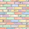 Seamless repeating background texture featuring a pattern of distressed vintage pastel colored painted bricks arranged in a Royalty Free Stock Photo