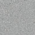 Seamless repeating texture featuring fine silver metallic glitter flakes embedded within a light gray composite material creating Royalty Free Stock Photo