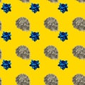 Seamless repetitive pattern of tinsel and bow ribbon on the yellow background Royalty Free Stock Photo