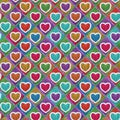 Seamless Romantic Scandinavian Style Handmade Colorful Knitted Fur Trim Hearts on green background pattern illustration. Royalty Free Stock Photo
