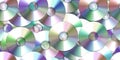 Seamless scattered pile or stack of vintage compact discs (CDs, DVDs or CD-ROMs) Royalty Free Stock Photo