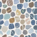 Seamless sea stone pattern on light background. Natural coloured pebbles of different shapes. Flat style