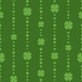 Seamless shamrock ornament with green beads of dots and clover leaves on dark green background Royalty Free Stock Photo