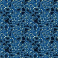 Seamless simple cute pattern of blue and yellow curled design elements on navy background.Endless ornament.Colourful backdrop for