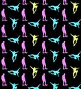 Seamless skateboarding pattern with multi-colored silhouettes of skateboarders on black background