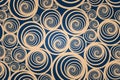 Seamless spiral gold pattern with dark blue background