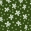 Seamless spring pattern with light green small rustic flowers on a dark green background. Doodle style