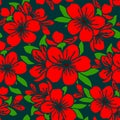 seamless symmetrical graphic pattern of red flowers on a green background Royalty Free Stock Photo