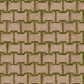 Seamless texture of green grass sprouted between bricks of cobblestone path, top view. Royalty Free Stock Photo