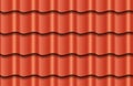 Seamless texture of red waves rooftop background. Repeating pattern of traditional ceramic roof tiles