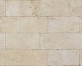 Seamless texture of travertine stone wall blocks Royalty Free Stock Photo