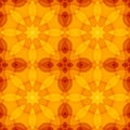 Seamless texture with warm orange red yellow kaleidoscope floral pattern