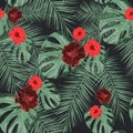 Seamless tropical pattern with hibiscus flowers and exotic palm leaves. Royalty Free Stock Photo