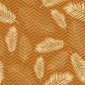 Seamless tropics background. Tropical leaves on a background of zigzag lines in a fashionable mustard color.