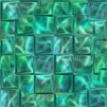 Seamless turquoise texture with protruding cubes. Glass squares stick out unevenly from the surface.