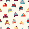 Seamless vector background knitted wool hats. Warm winter clothes wear pattern. Hand drawn cozy and warm accessories. Scandinavian Royalty Free Stock Photo