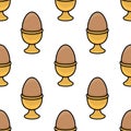 Seamless vector pattern of brown eggs in golden egg cups, a delightful illustration perfect for Easter-themed designs or breakfast Royalty Free Stock Photo