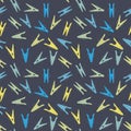 Seamless vector pattern with colorul clothes pis scattered on a dark background