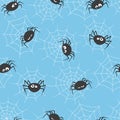 Seamless vector pattern with cute spiders and spider webs. Royalty Free Stock Photo