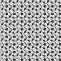 Seamless vector pattern, grey symmetrical background with elements of black soccer balls Royalty Free Stock Photo