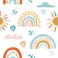 Seamless vector pattern with hand drawn rainbows and sun. Trendy baby texture Royalty Free Stock Photo