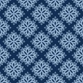 Seamless vector pattern of lacy paper flowers on classic blue background