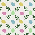 Seamless vector pattern of pastel Easter eggs and green sprigs on a Cloud Dancer background Royalty Free Stock Photo