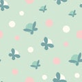 Seamless vector pattern with polka dots and butterflies in pastel teal and pink