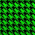 Seamless vector pattern - Popular houndstooth pattern with a gradient from dark green to light green on a black background