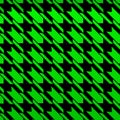 Seamless vector pattern - Popular houndstooth pattern with a gradient from dark green to light green on a black background Royalty Free Stock Photo