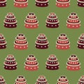 Seamless vector pattern with red christmas cakes on green background