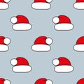 Seamless vector pattern. Red Christmas hats on grey. Christmas background for festive designs, textile print, wrapping Royalty Free Stock Photo