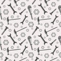 Seamless vector pattern with tools. Chaotic baackground with screws, nuts, hammers, wrenches and screwdrivers on the grey backdrop