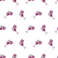 Seamless vector pattern with wineglasses with red wine and bunches of grape on the white background. Royalty Free Stock Photo