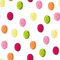 Seamless vector polka dots pattern with colorful hard candies on a white background