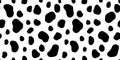 Seamless whimsical abstract hand drawn animal spots pattern or cow print motif.