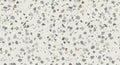 Seamless white terrazzo surface featuring scattered grey and brown stone fragments creates a modern, textured background for Royalty Free Stock Photo