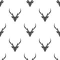 seamless winter pattern with black silhouette of deer head with antlers. vector flat Christmas ornament Royalty Free Stock Photo
