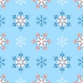 Seamless winter pattern with ornate snowflakes in red and white on a blue background Royalty Free Stock Photo