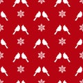 Seamless winter pattern with white snowflakes and red birds cardinals Royalty Free Stock Photo