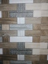 Seamless wood texture tile pattern with mixed brown, beige, and gray tones, arranged in a modern geometric Royalty Free Stock Photo
