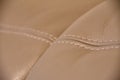 Seams on begge grey leather texture of sofa Royalty Free Stock Photo