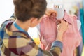 Seamstress adjusting clothing on mannequin Royalty Free Stock Photo