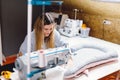 Seamstress dressmaker woman working with sewing machine in workshop Royalty Free Stock Photo