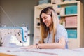 Seamstress dressmaker woman working with sewing machine in workshop Royalty Free Stock Photo