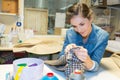 Seamstress hand sewing material in workshop Royalty Free Stock Photo