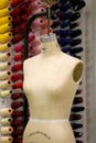 Seamstress mannequin with the workshop in the back Royalty Free Stock Photo